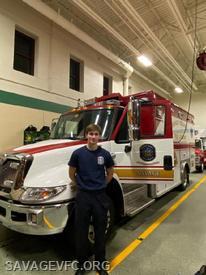 EMT Ben Gallagher standing in front of Ambulance 66.